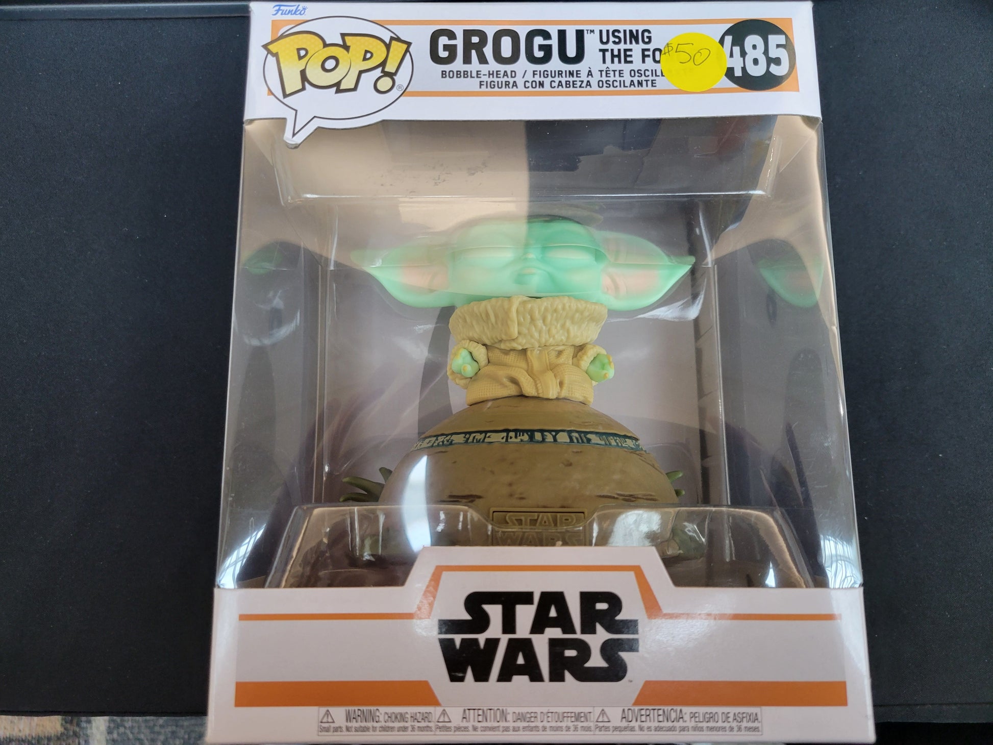 Celebrate the epic saga of the Mandalorian with a POP figure of the child Grogu.  These figures come complete with their original box and are in the likeness of your favorite character! Place them in your office, bedroom, or wherever you want to display your allegiance!  Vinyl bobblehead is approximately 4.25-inches tall, or 4.15-inches tall.