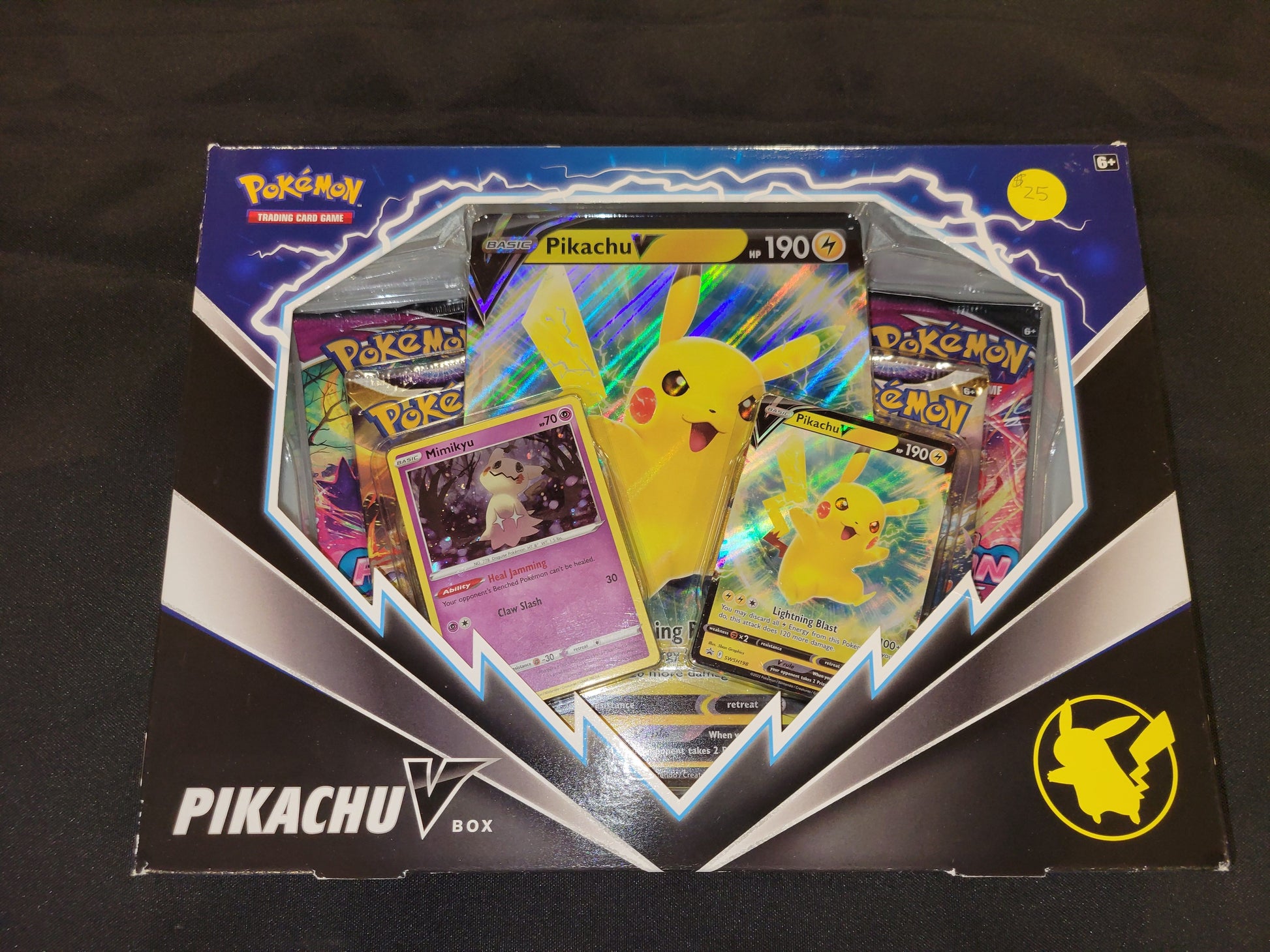 Each Pikachu V box comes with one oversized PikachuV card, one holofoil Pikachu card, one online code card and four tcg packs.