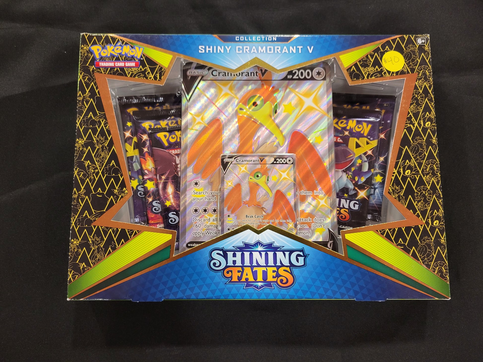 Each Shining Cormorant box comes with one oversized Cormorant card, one holofoil Cormorant card, one online code card and four tcg packs.
